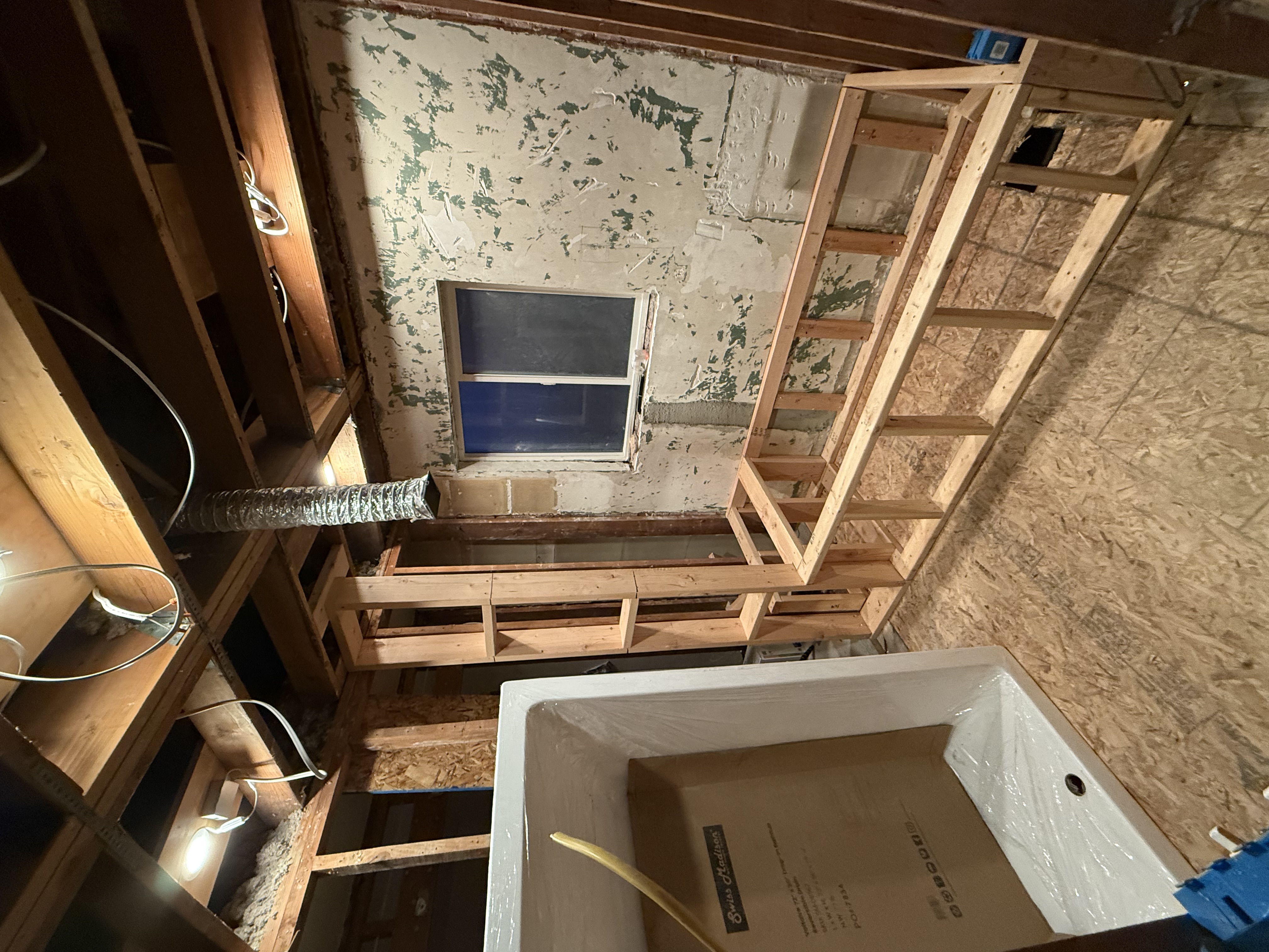 Bathtub framing with built-in shelf